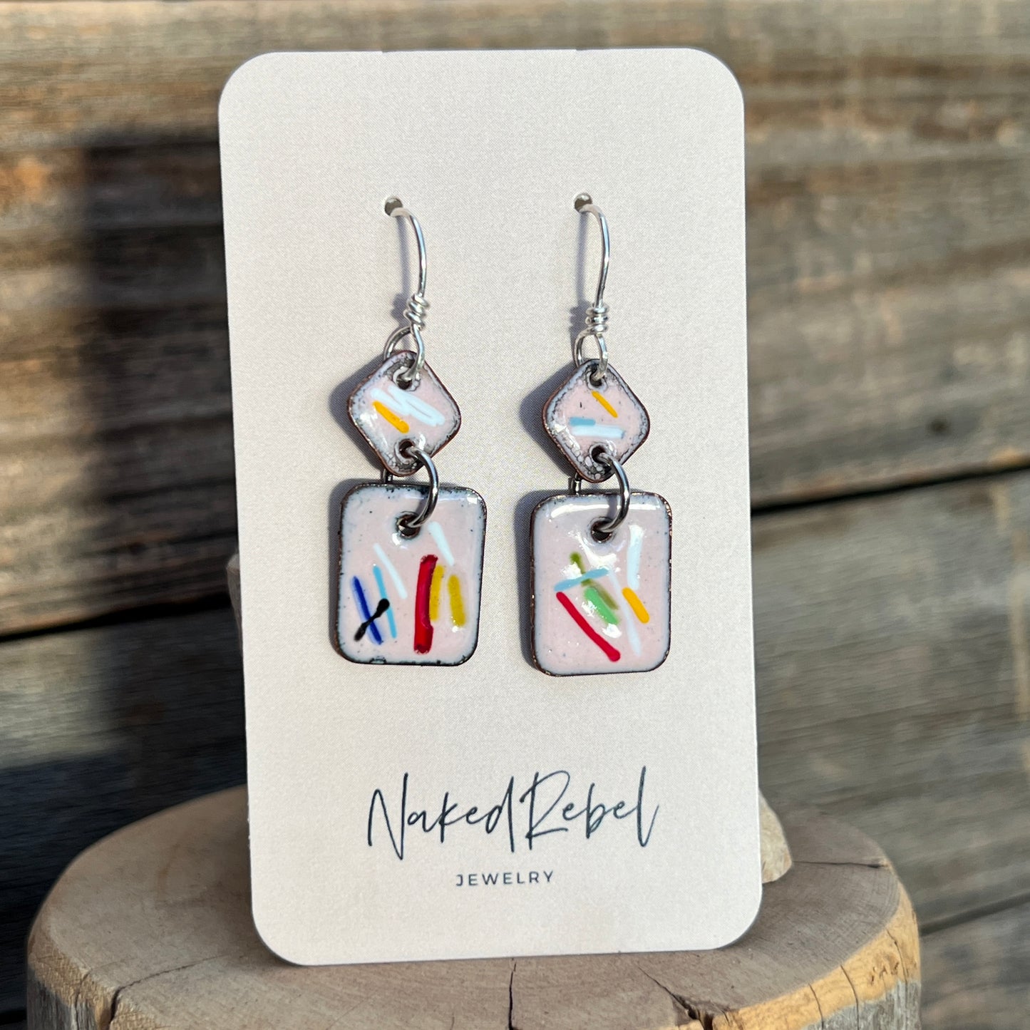 Fun pink enamel earrings, with splashes of color. Sterling Silver ear wires. Handmade.