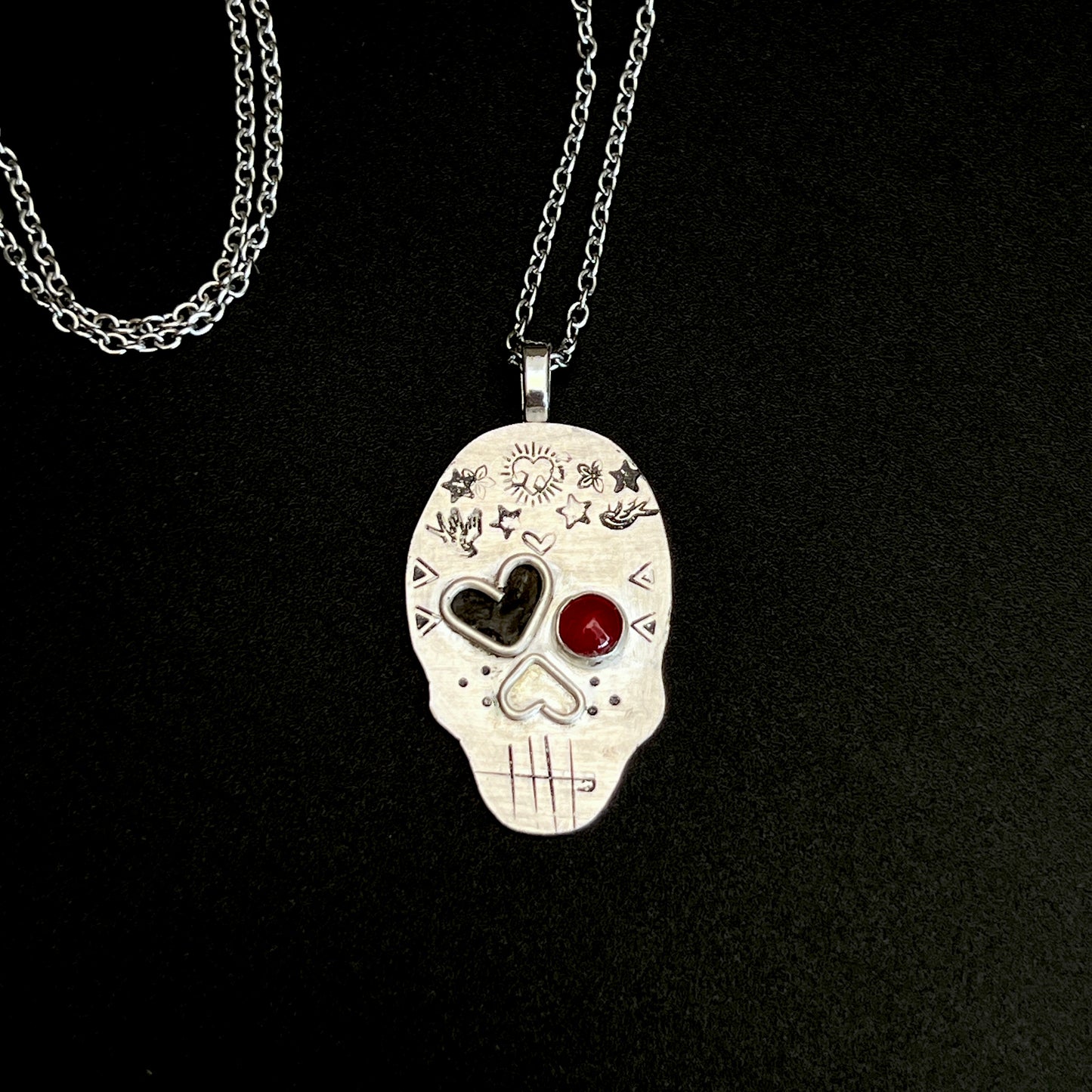 Edgy Coral-Eyed Skull Necklace: Sterling Silver