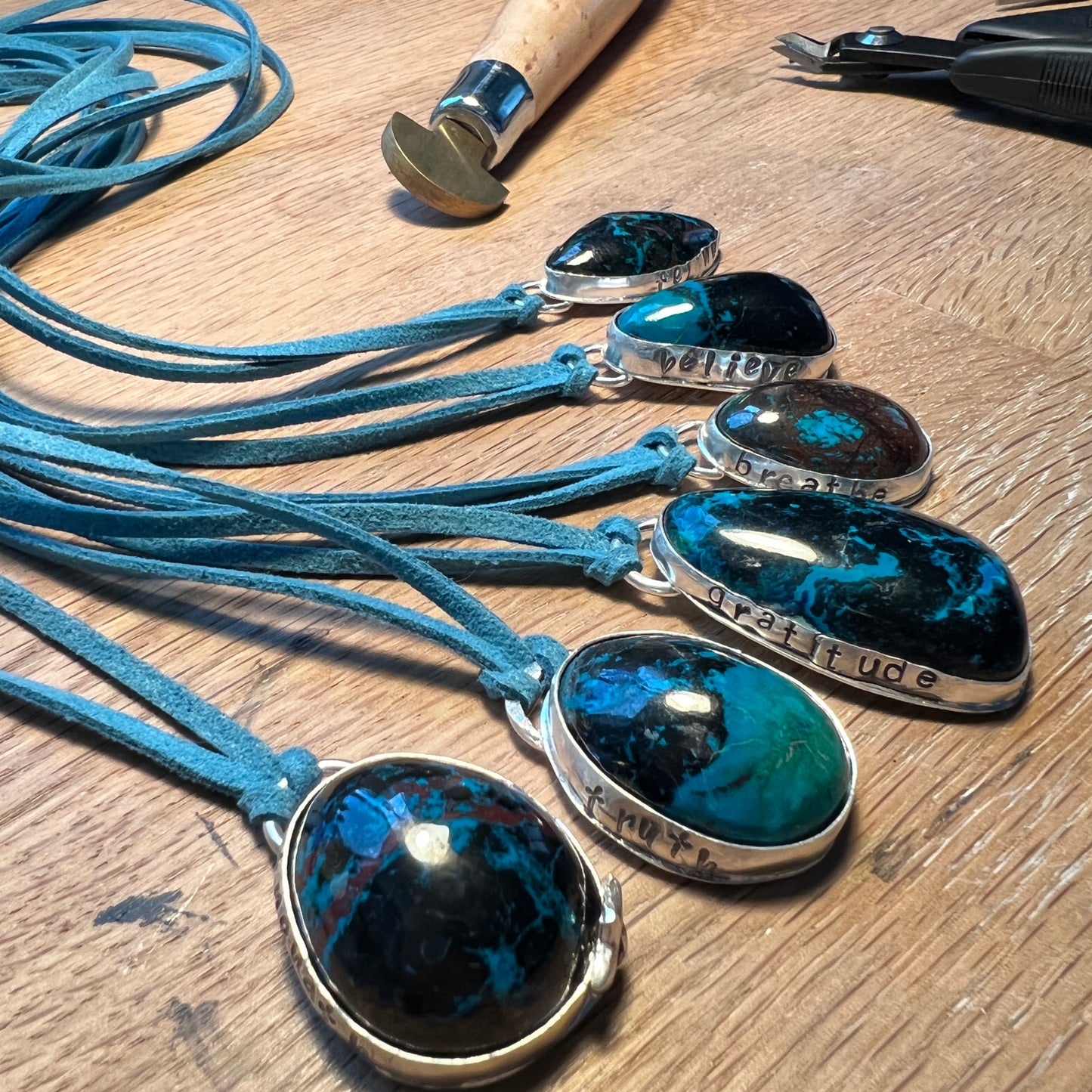 Bisbee Shattuckite sterling silver pendant on blue suede necklace