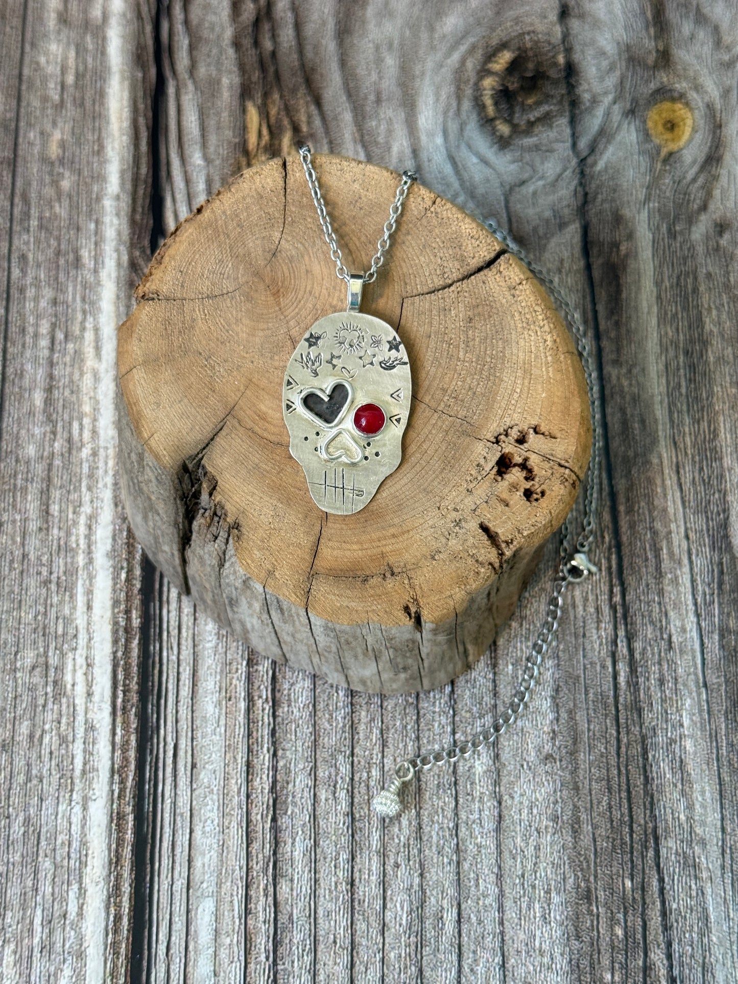 Edgy Coral-Eyed Skull Necklace: Sterling Silver