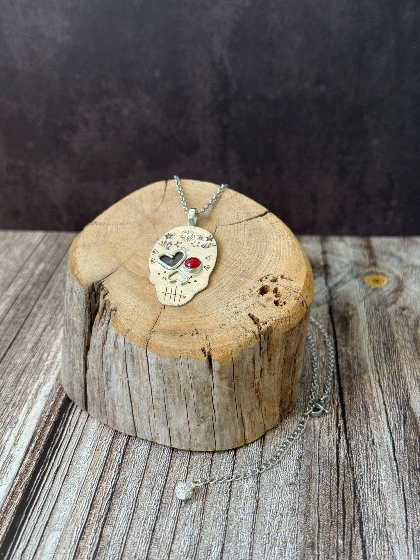 Edgy Coral-Eyed Skull Necklace: Sterling Silver